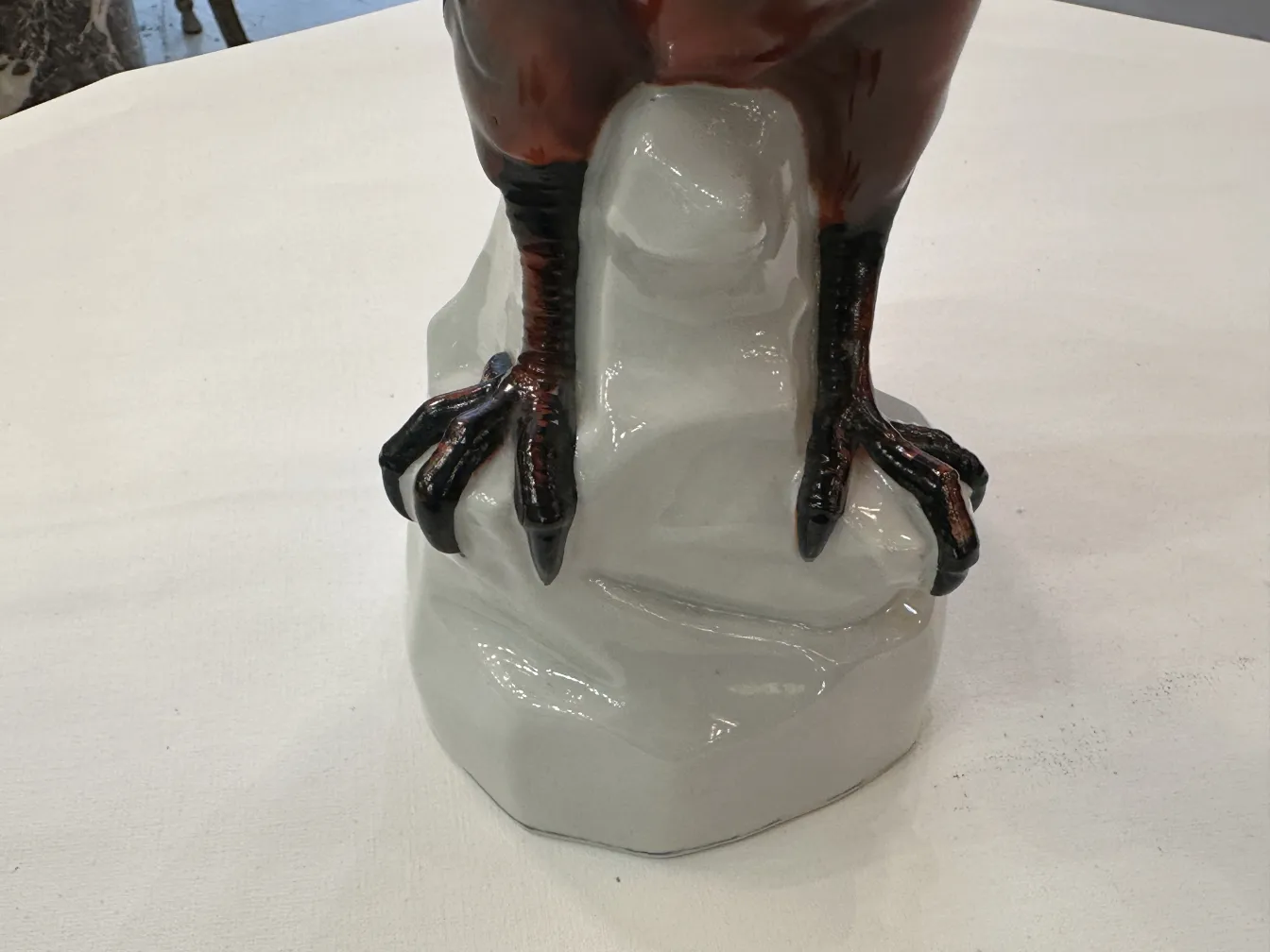 antique ceramic with decorative feet on white base
