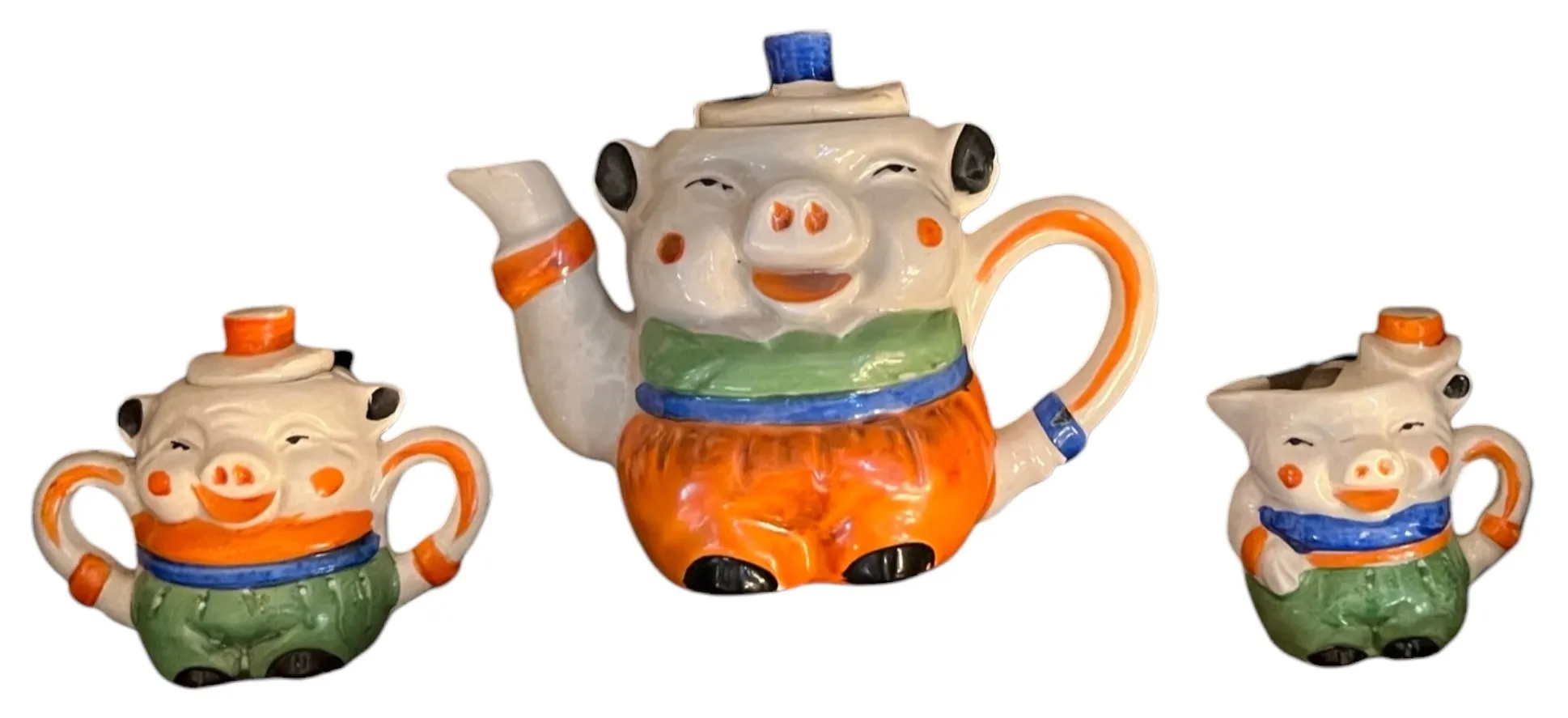 Antico set da tè in ceramica a forma di maiale con colori vivaci
