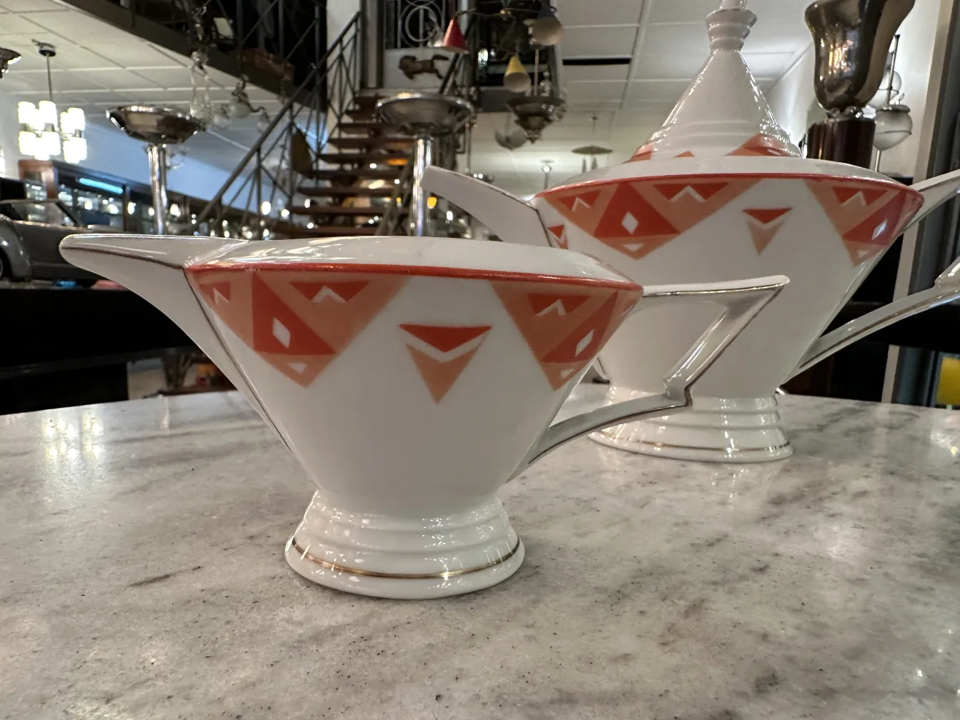 Antique tea set Volkstedt with colorful patterns on the table.