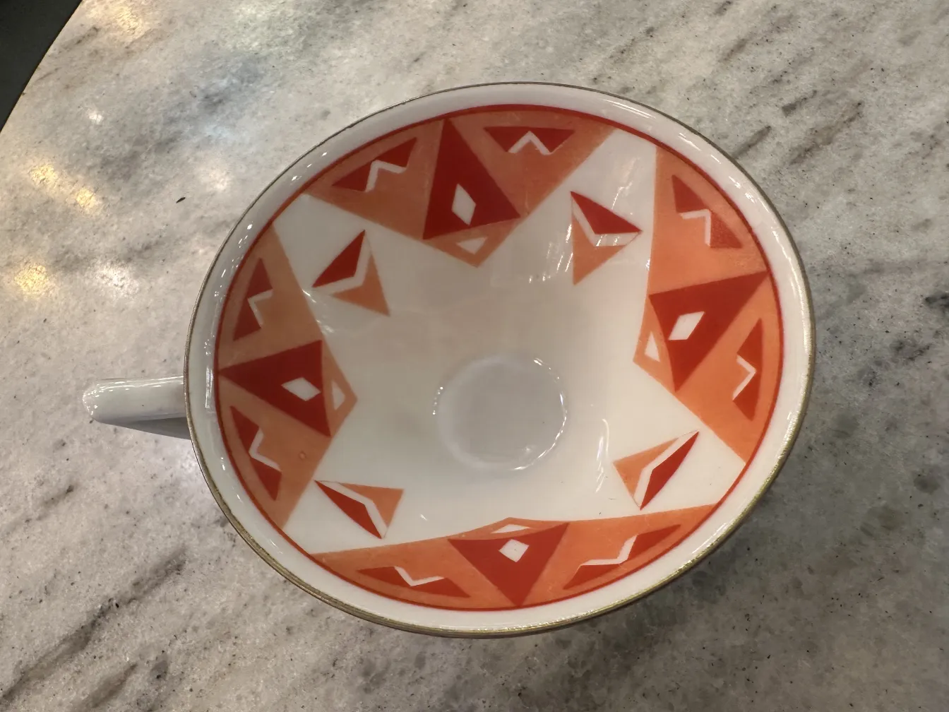 Antique tea set Volkstedt with colorful patterns on the table.