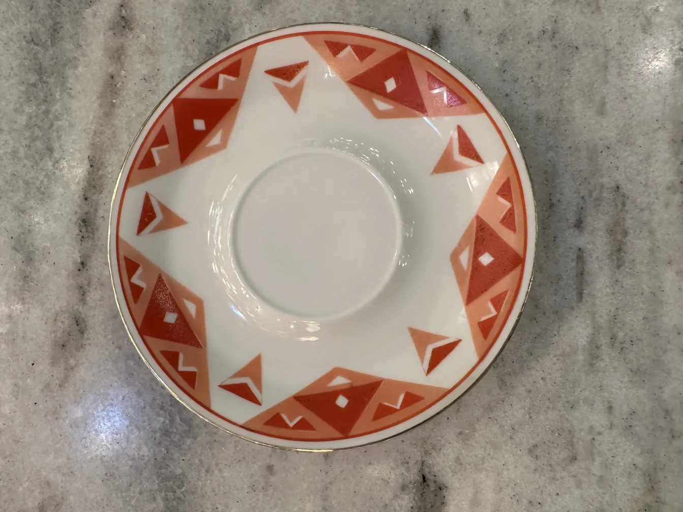 Antique tea set Volkstedt with colorful patterns on the table.