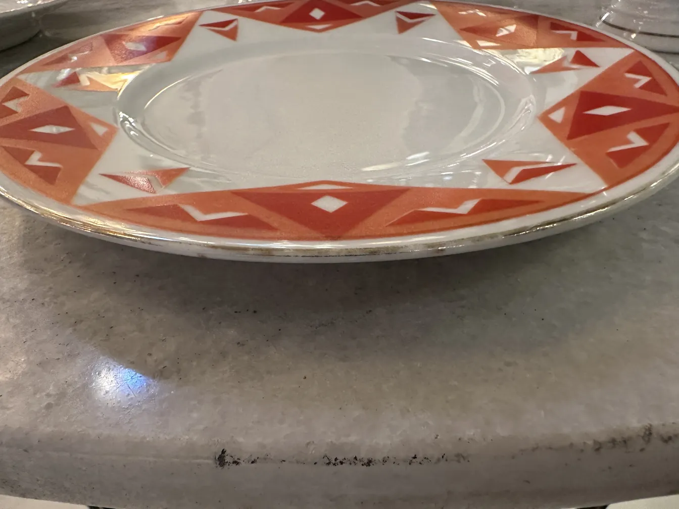 Antique tea set Volkstedt with colorful patterns on the table.