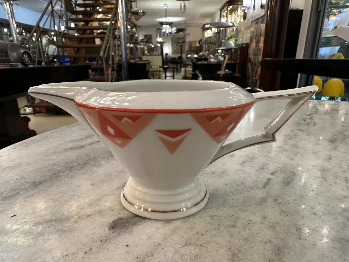 Antique tea set Volkstedt with colorful patterns on the table.