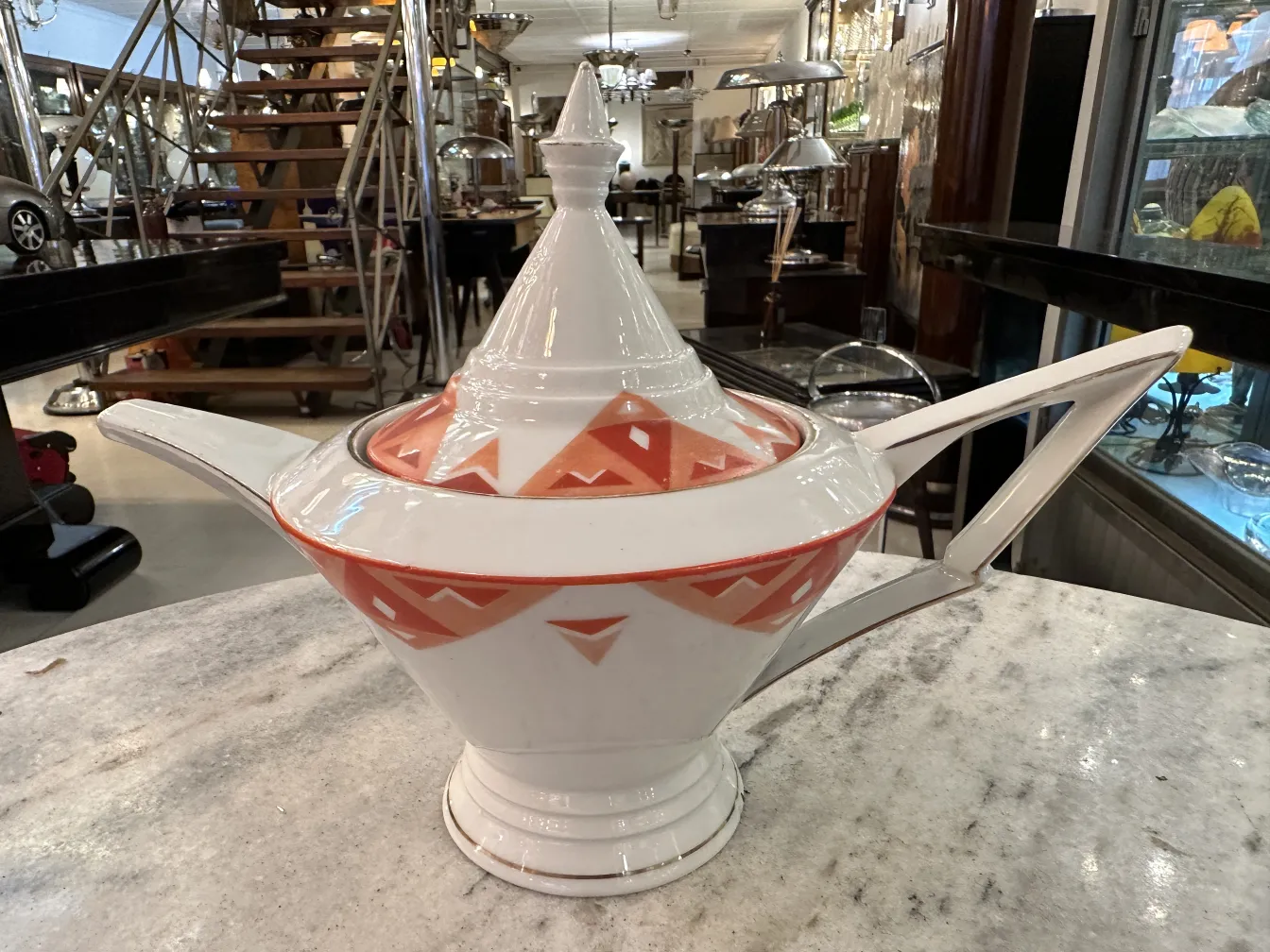 Antique tea set Volkstedt with colorful patterns on the table.