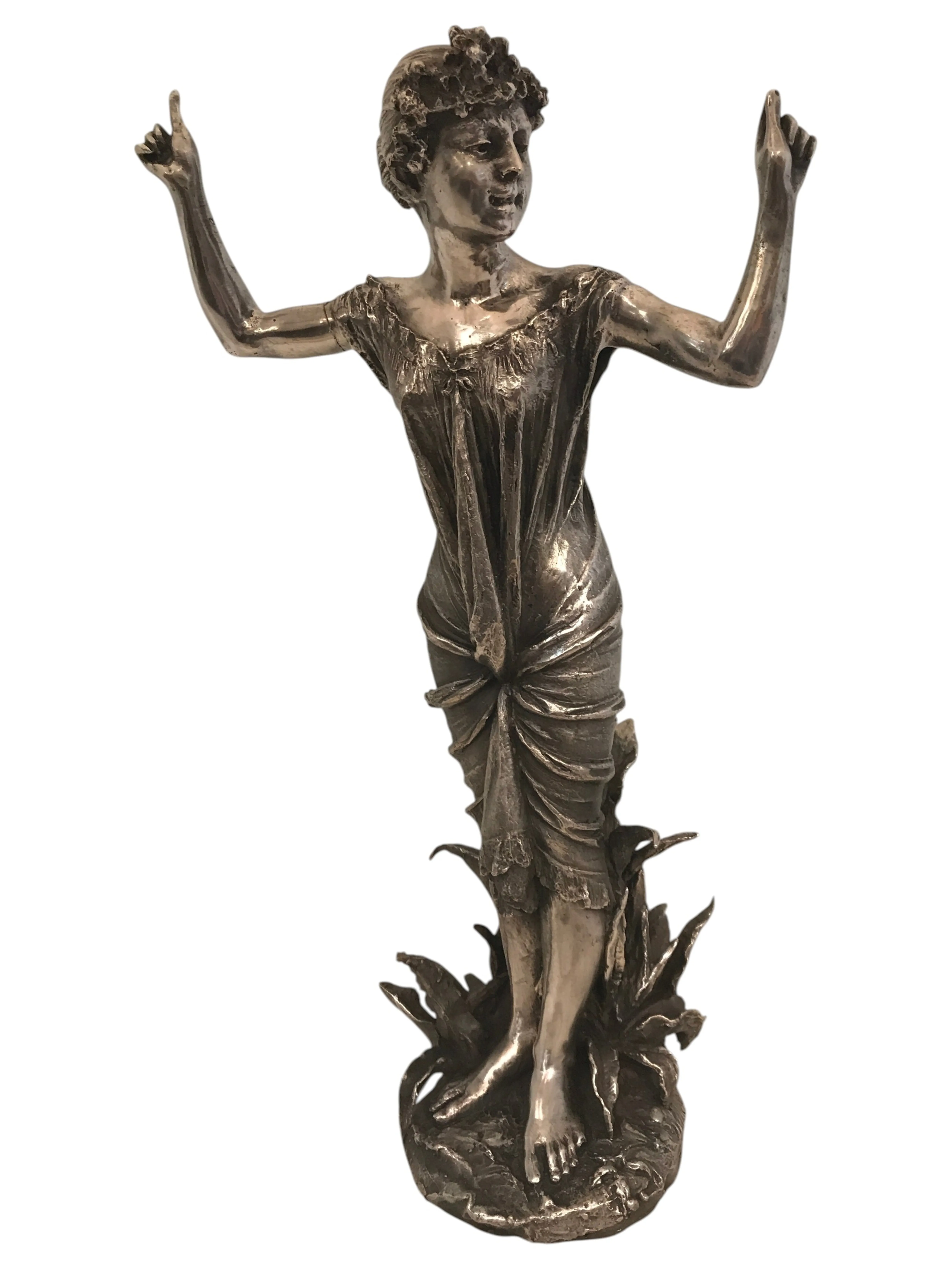 antique sculpture of a nude woman with floral details
