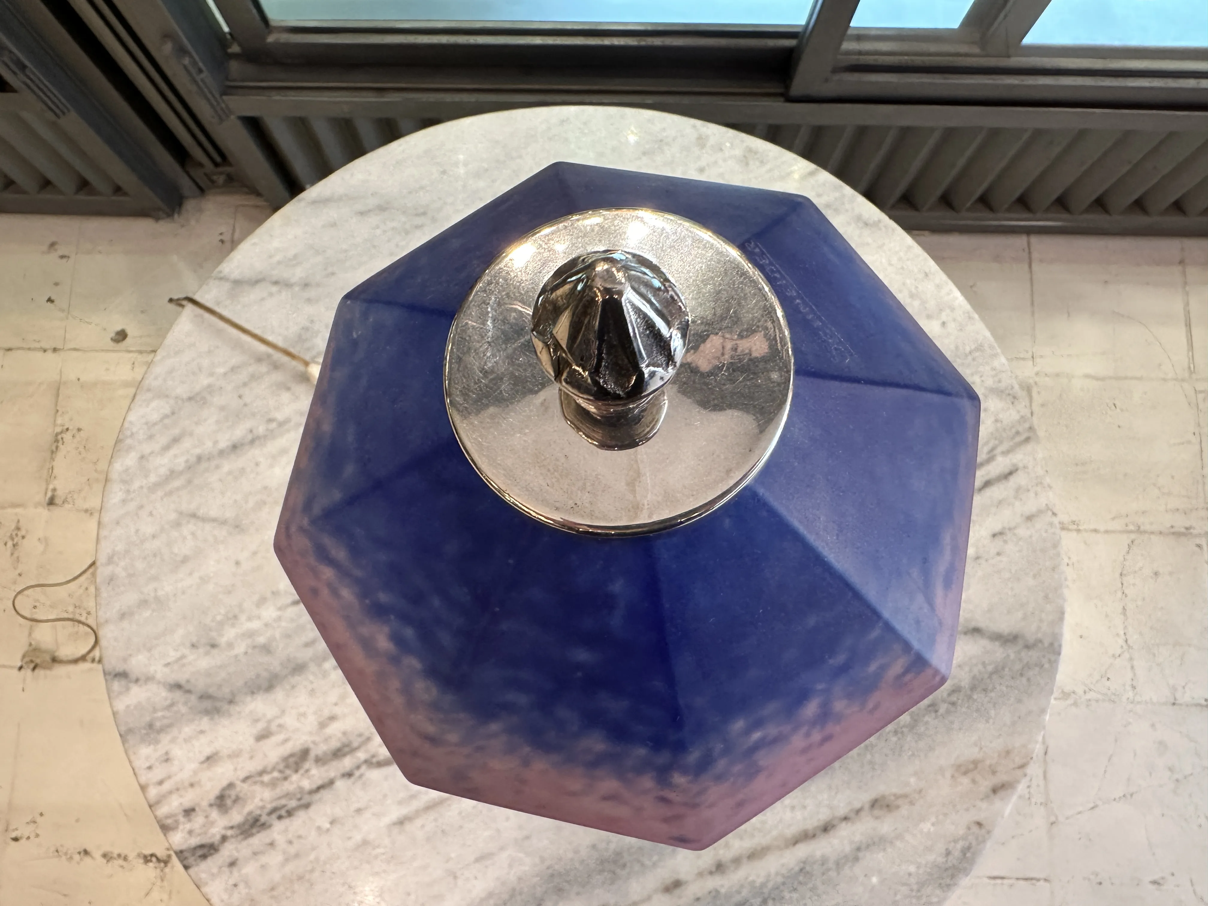 Top view of an antique table lamp in violet color