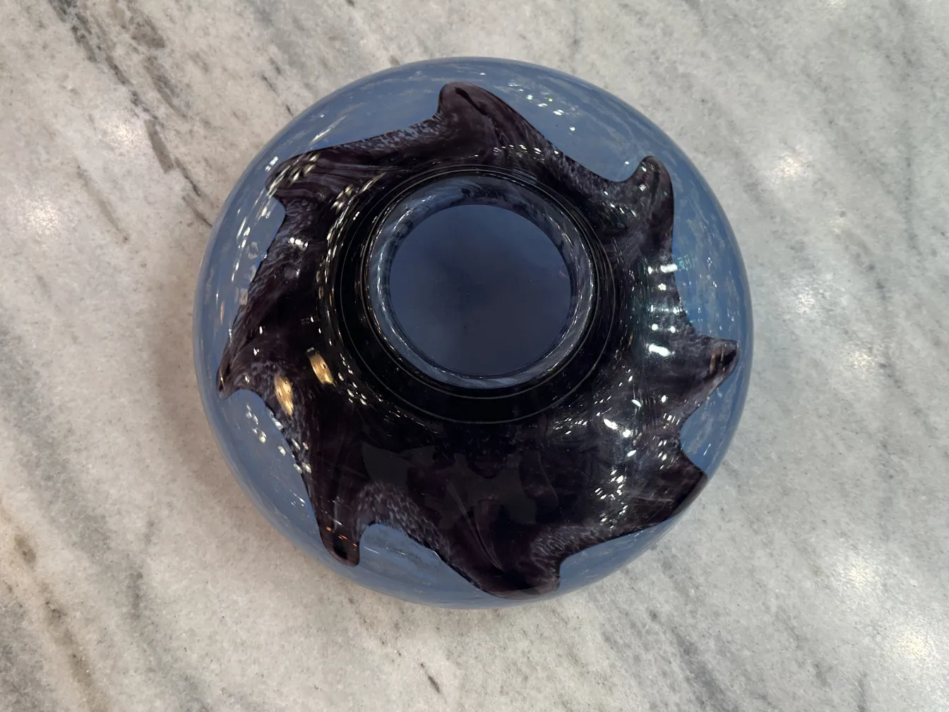 Top view of an antique signed glass Degué with wavy edges