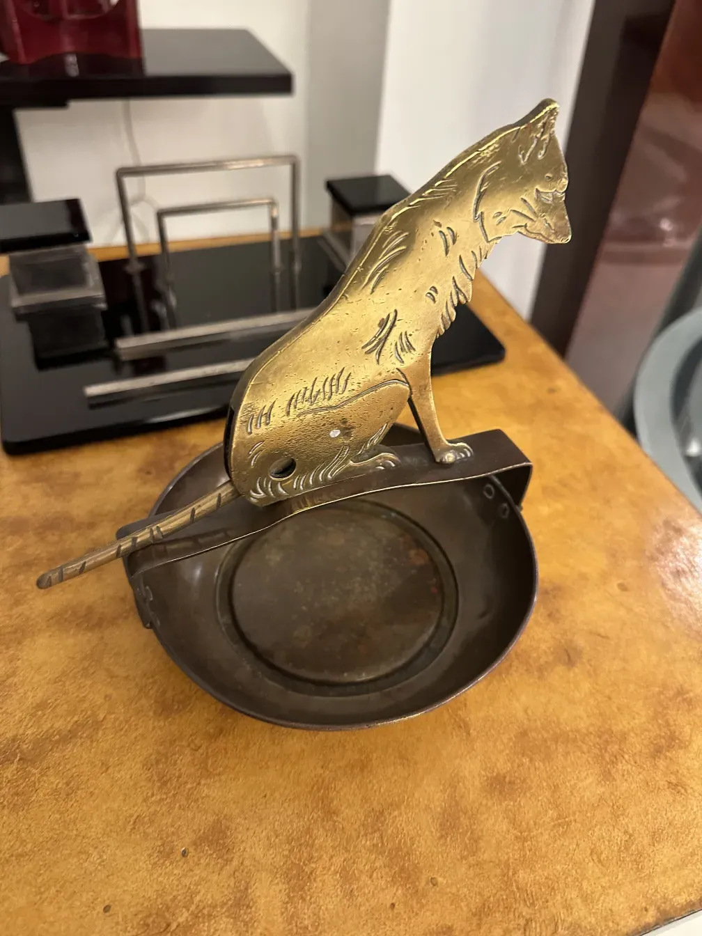 Antique cigar cutter with round base and cat design