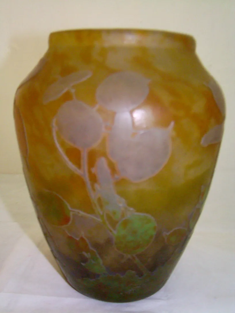 Antique signed Daum Nancy vase with natural design.