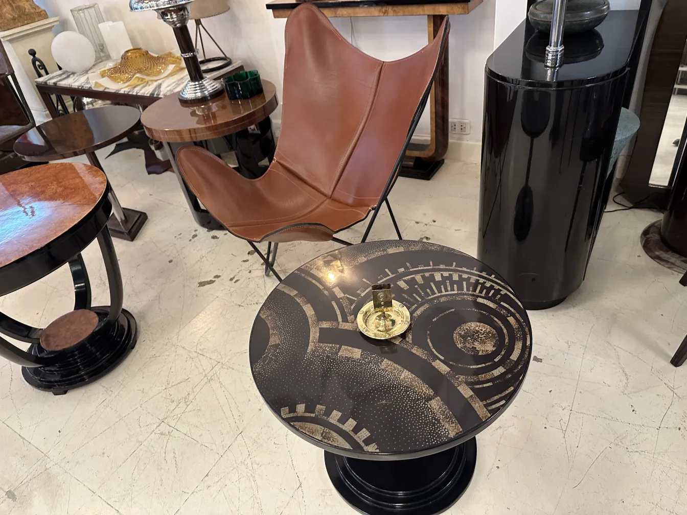 Antique WMF ashtray with decorative design and circular shape.