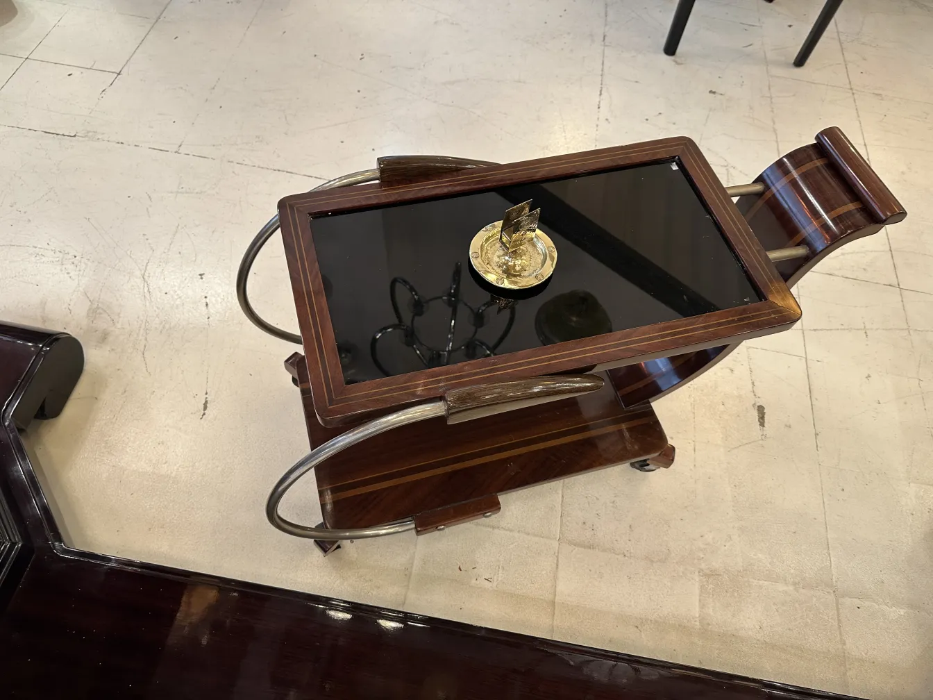 Antique WMF ashtray with decorative design and circular shape.