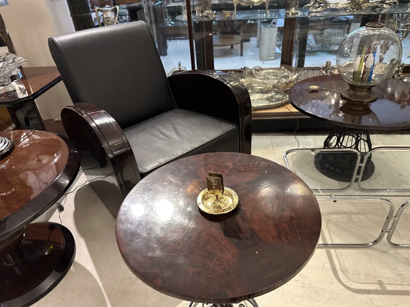 Antique WMF ashtray with decorative design and circular shape.