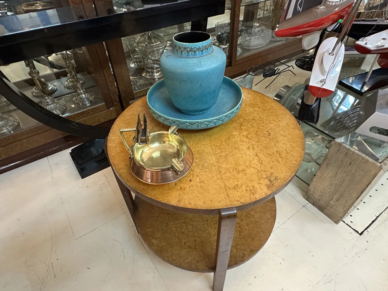 Antique ashtray on table with black surface
