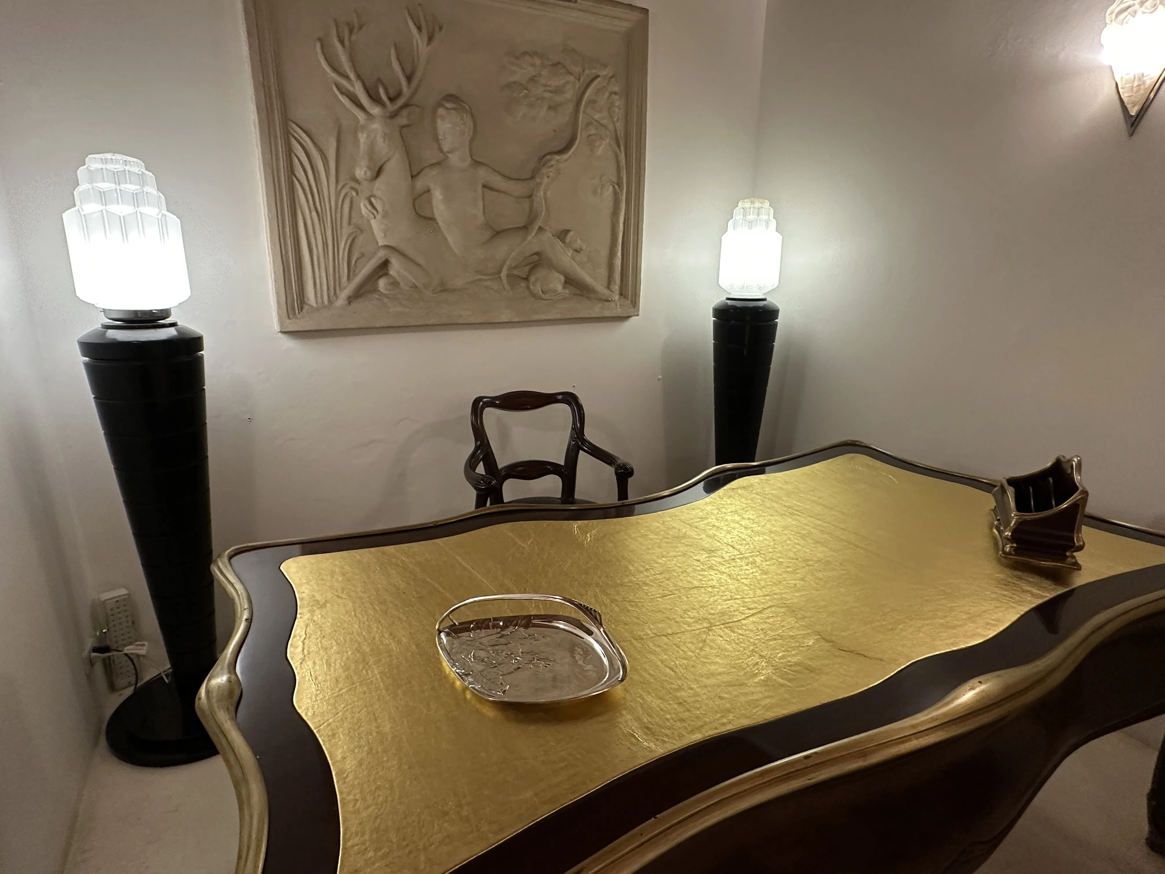Antique WMF card tray on a decorated desk.