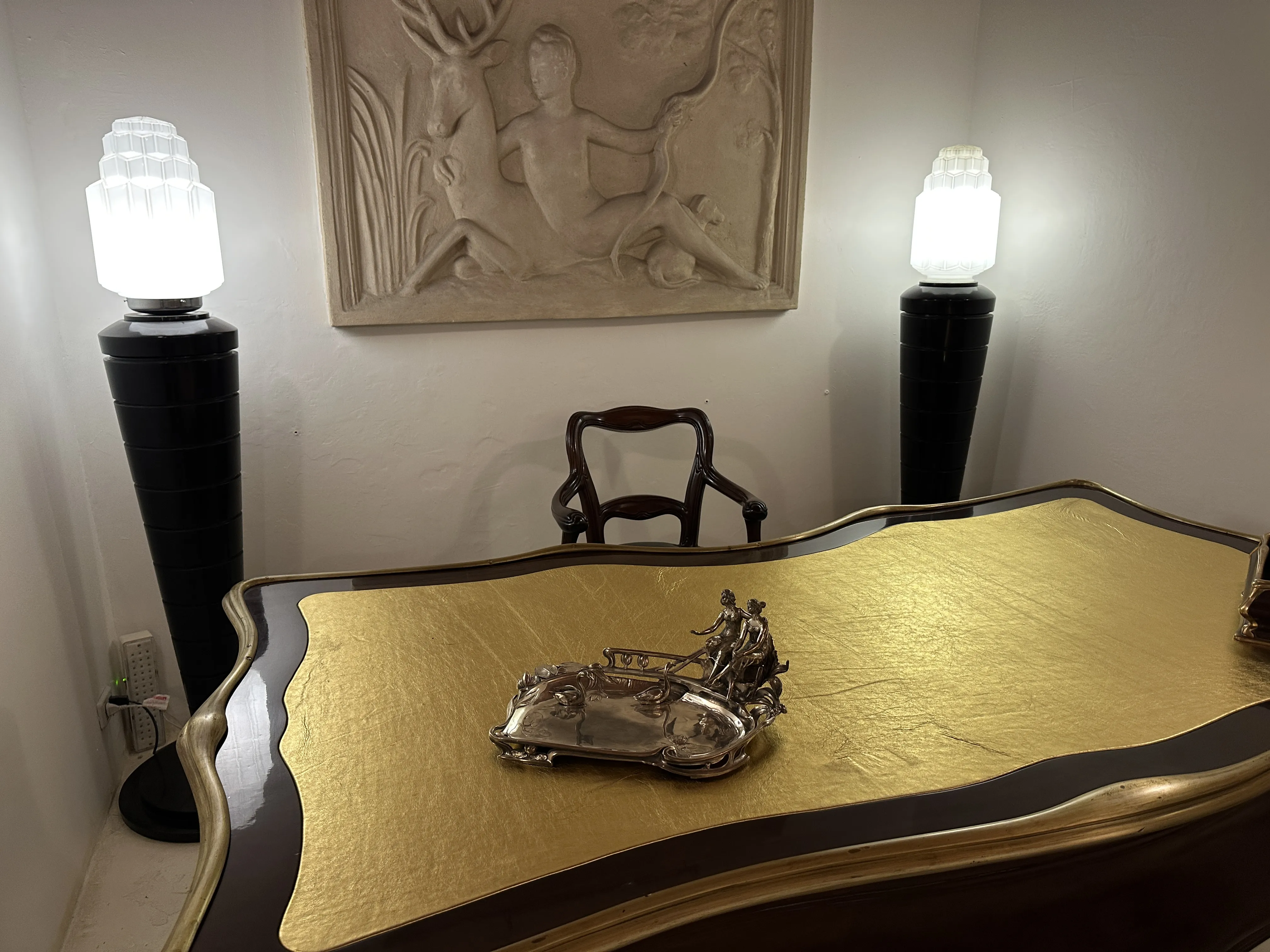 antique WMF card tray placed on a golden desk with soft lighting