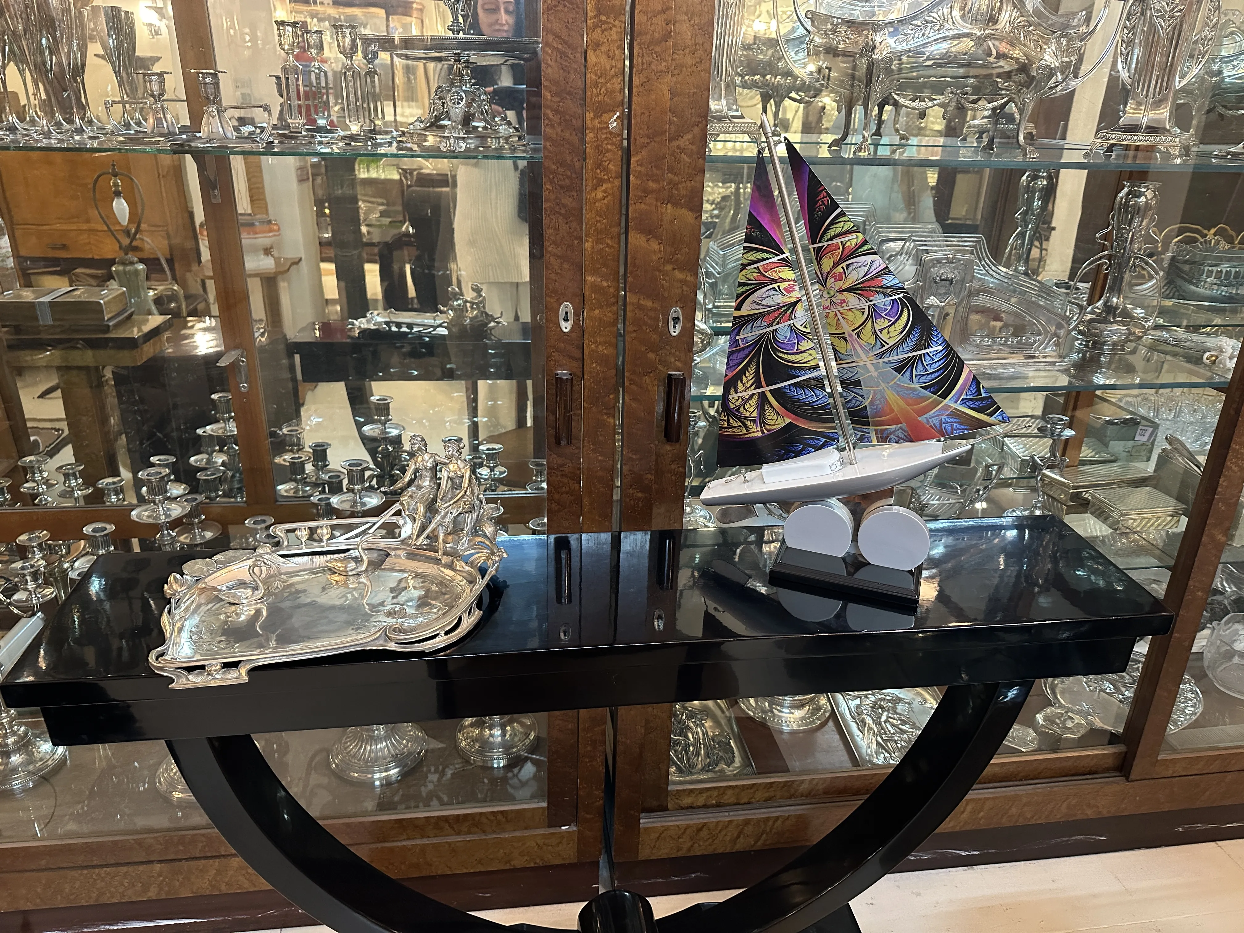 antique card tray with intricate designs, surrounded by antiques