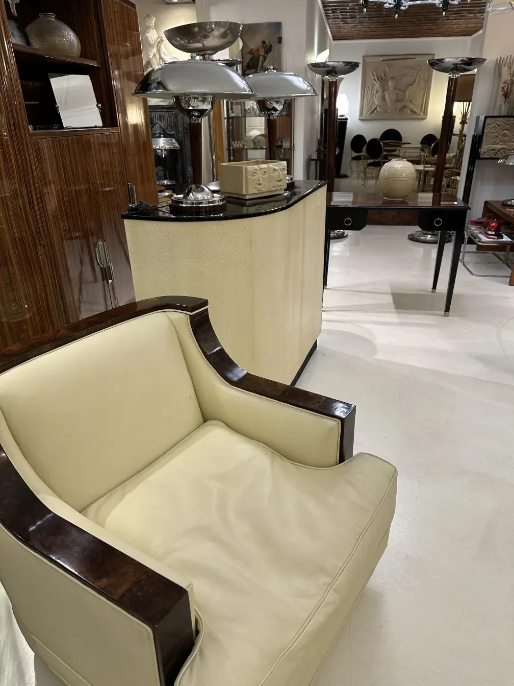 Antique wooden bar furniture with an elegant design, surrounded by decorative items.