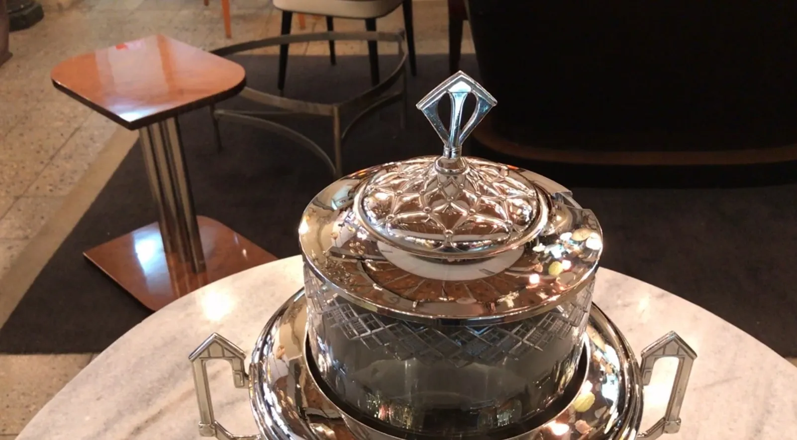 Antique WMF punch bowl with intricate design and crystal lid.