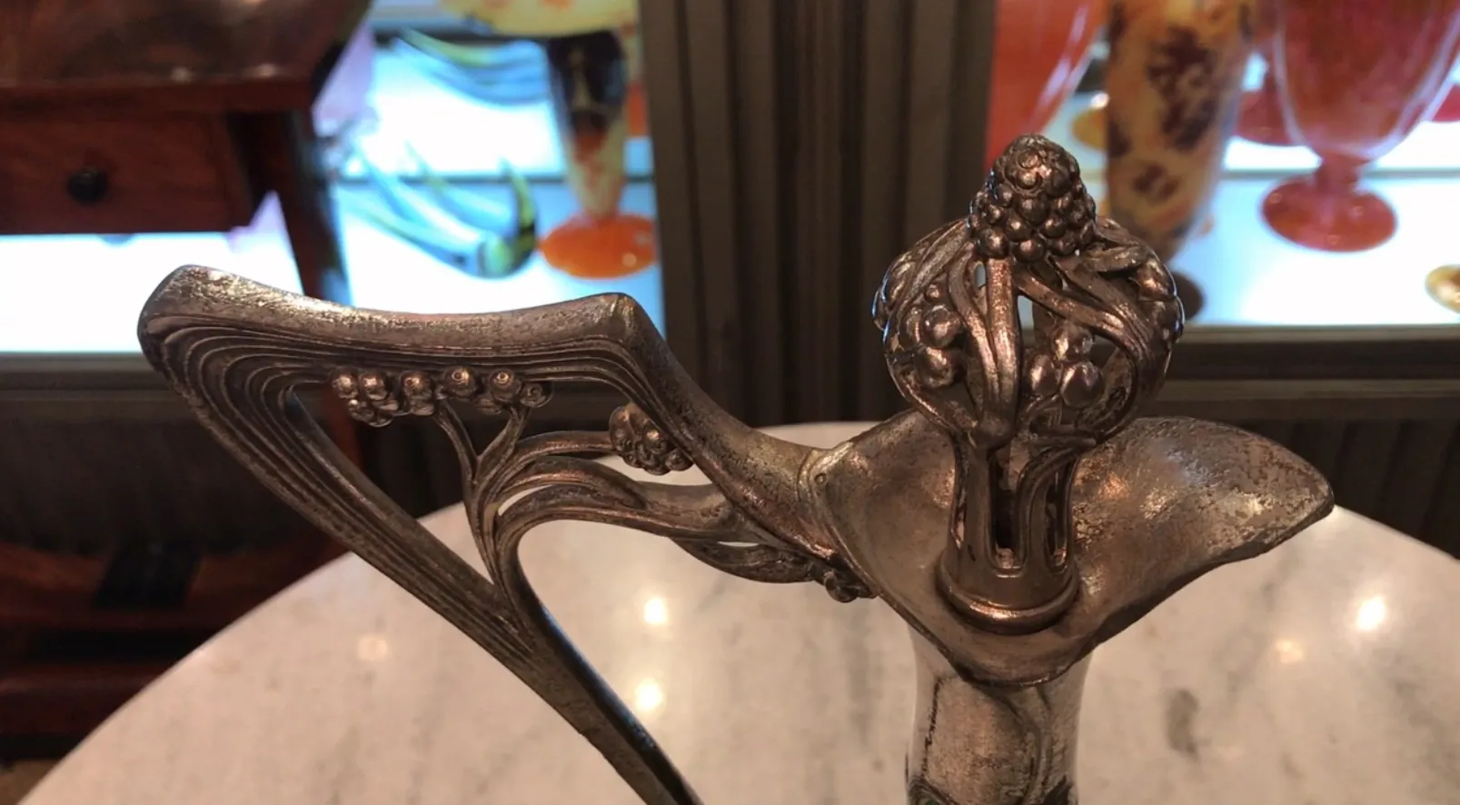Close-up of 2 WMF jars with floral decorations on the lid