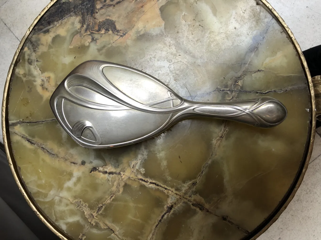 Antique hand mirror with an elegant design