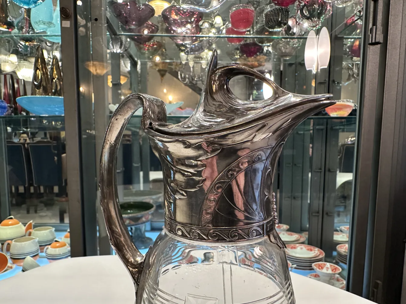 Two antique WMF jars featuring decorative details and an elegant design in a classic setting.