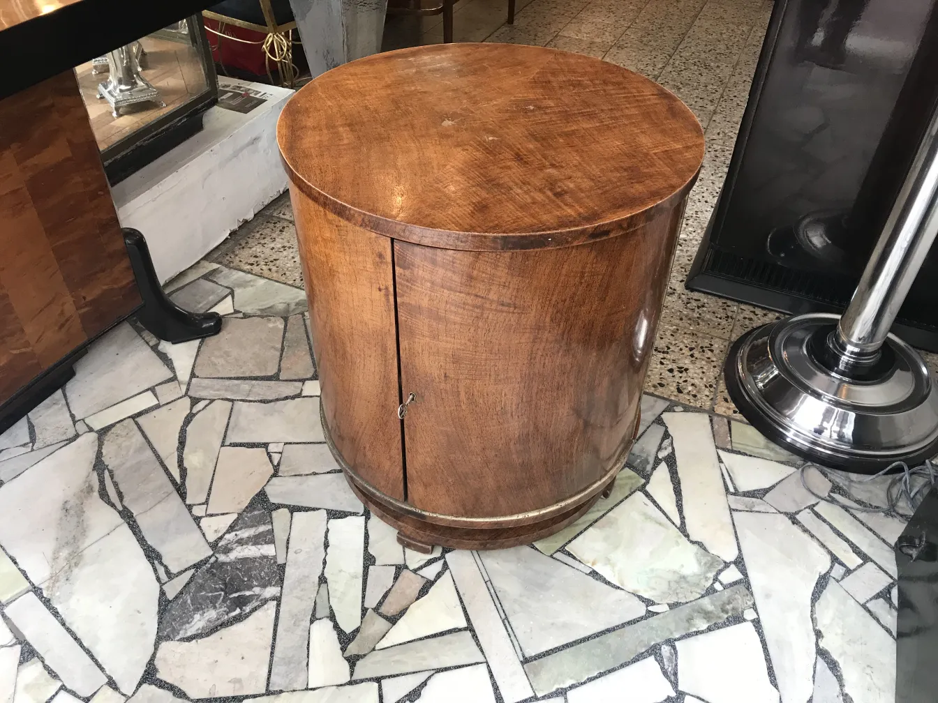 Antique wooden bar furniture with a rounded design.