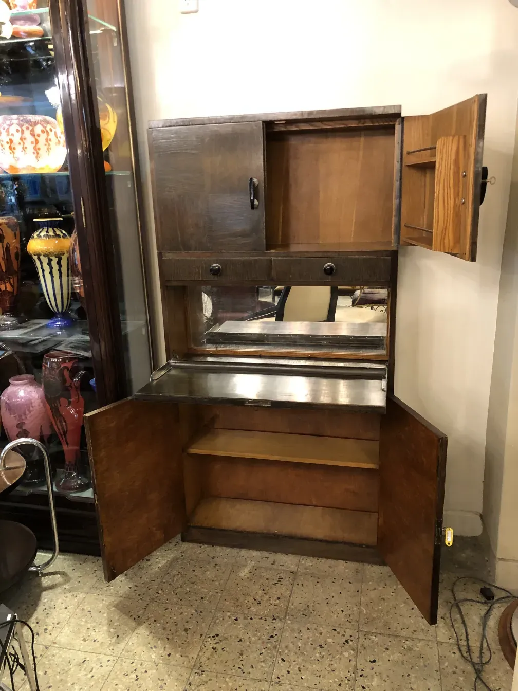 Antique bar furniture with compartments and mirror, decorated. Cozy bar ambiance.