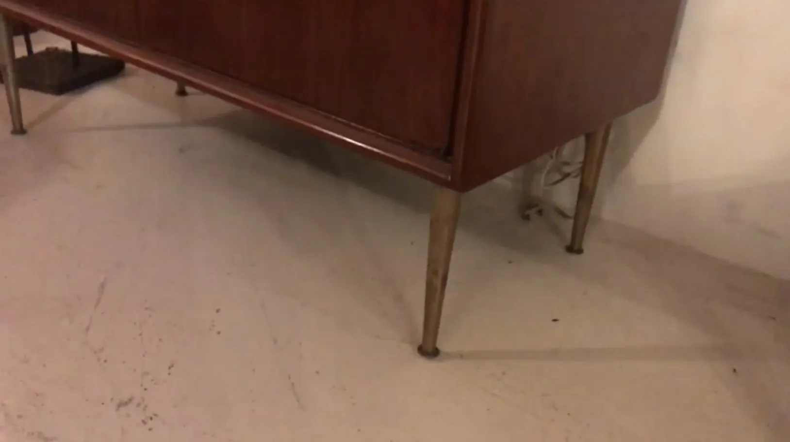 Antique wooden bar with elegant metal legs