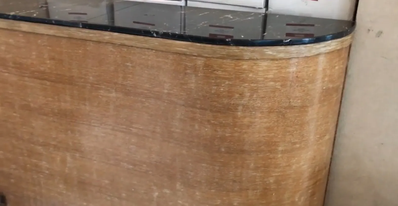 Antique bar cabinet with clear glass top and elegant design