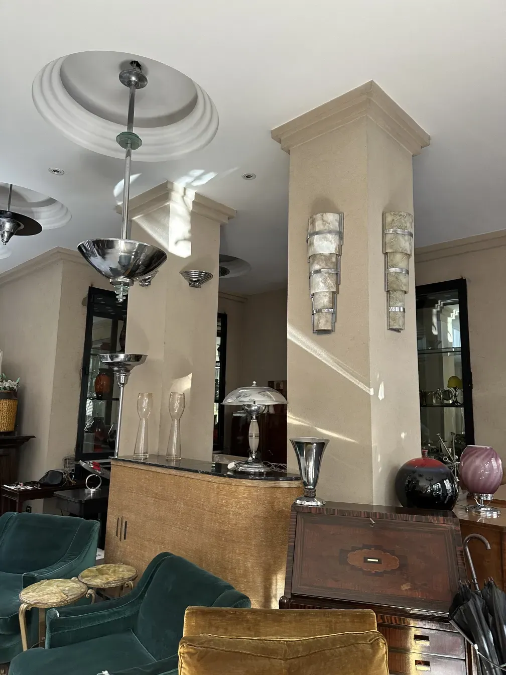 View of an antique bar with elegant details and glasses.