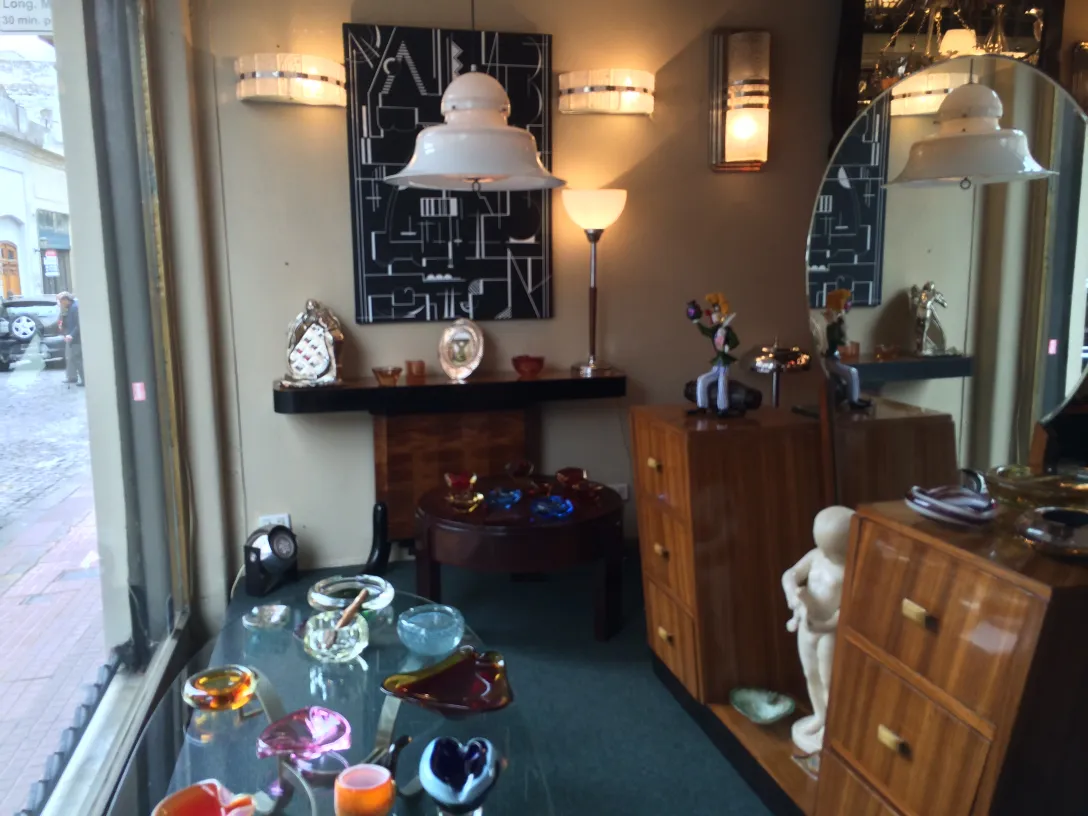 Antique pair of sconces illuminating an elegant setting.