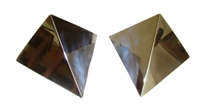 Pair of antique sconces with bright geometric design