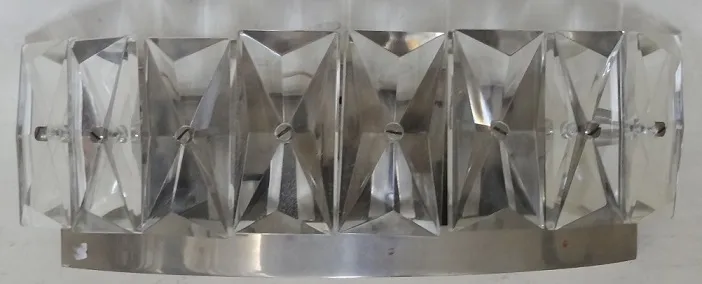 pair of antique sconces with clear geometric design