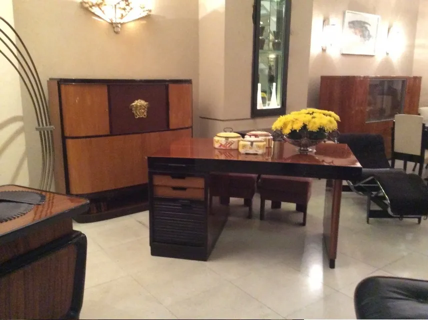 antique sideboard with pair of sconces, cozy setting