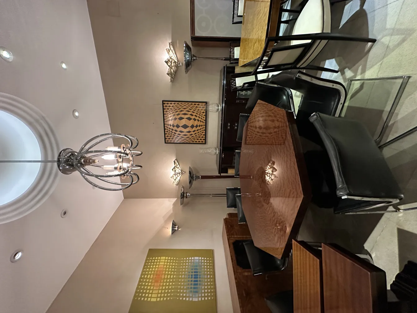 Antique sconces in an elegant setting with a wooden table