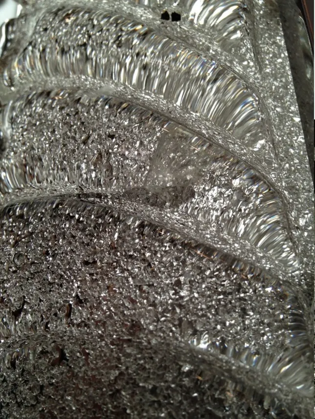 Intricate details of an antique pair of glass sconces, perfect for décor