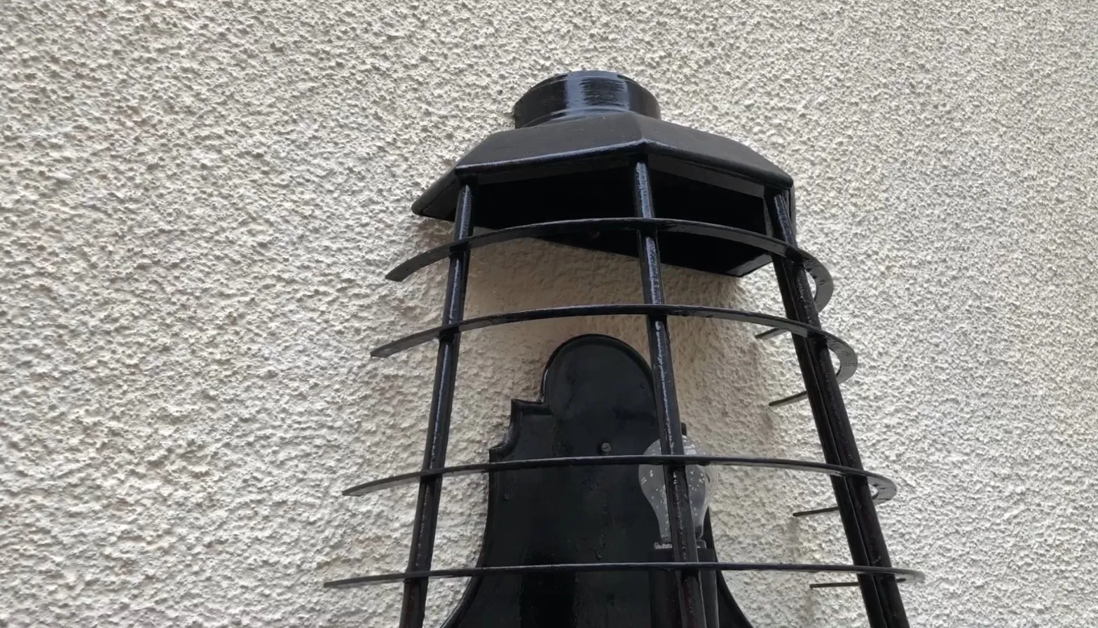 Black antique sconces with decorative grills