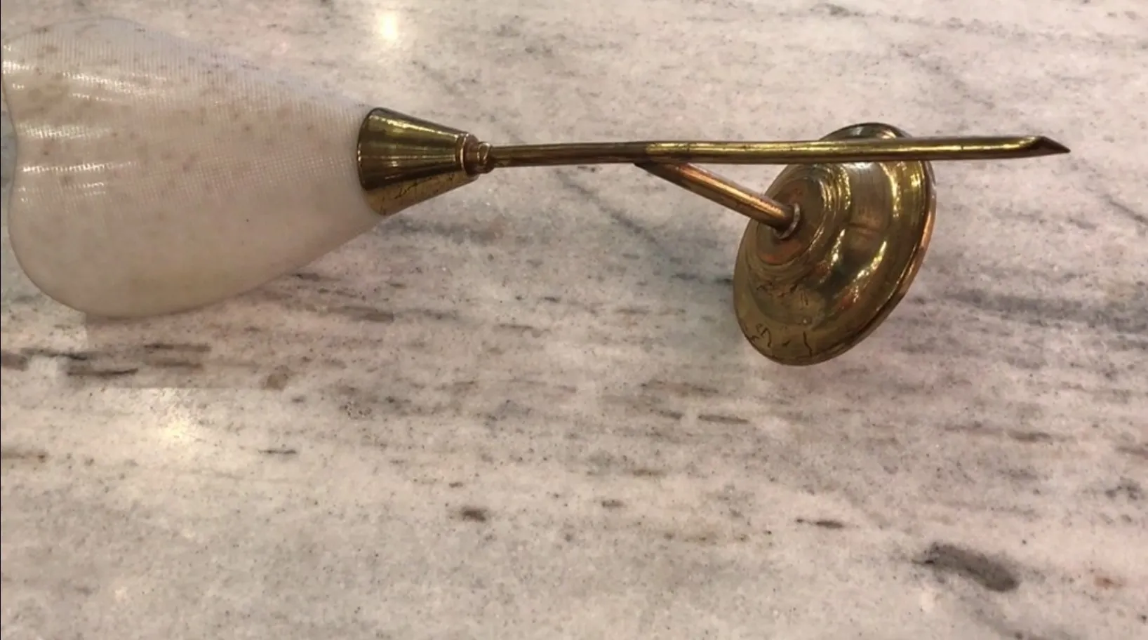 Antique sconces with gold arm and soft shade