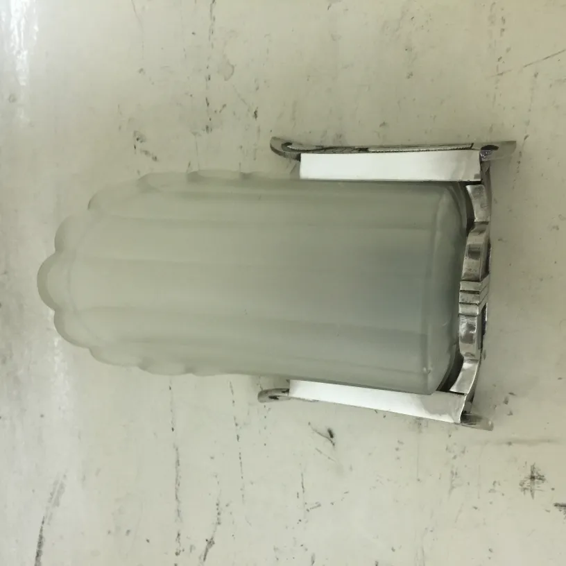 Pair of vintage sconces with elegant design, perfect for decor.