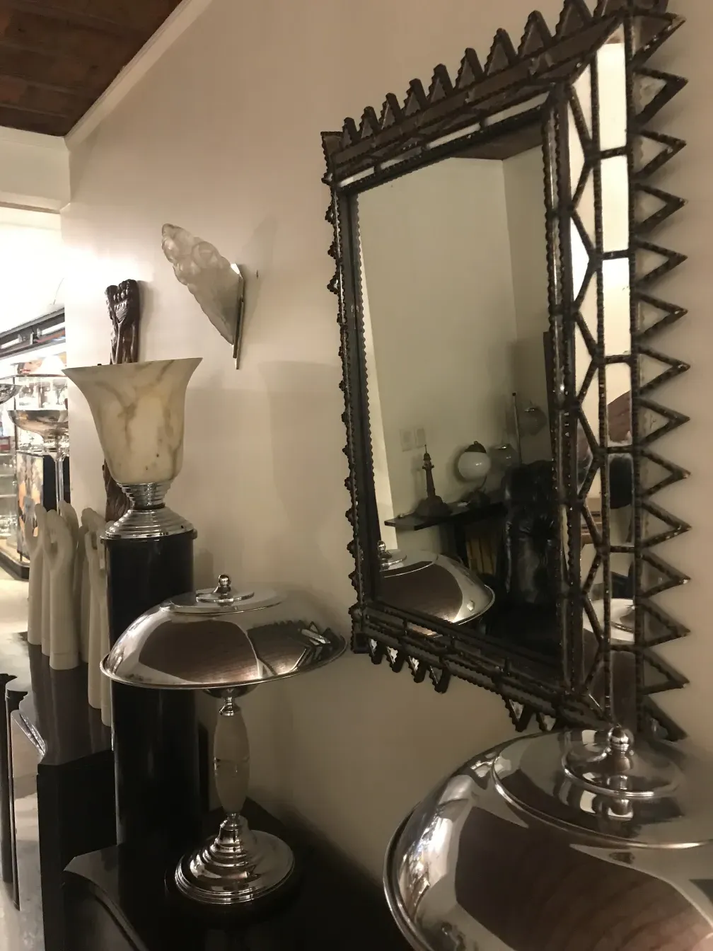 antique pair of sconces in elegant setting with mirror