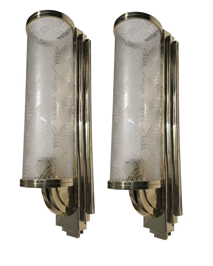 Pair of antique sconces with art deco design, featuring a sophisticated style perfect for elegant spaces.