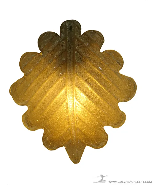 Antique leaf-shaped sconces providing warm illumination.