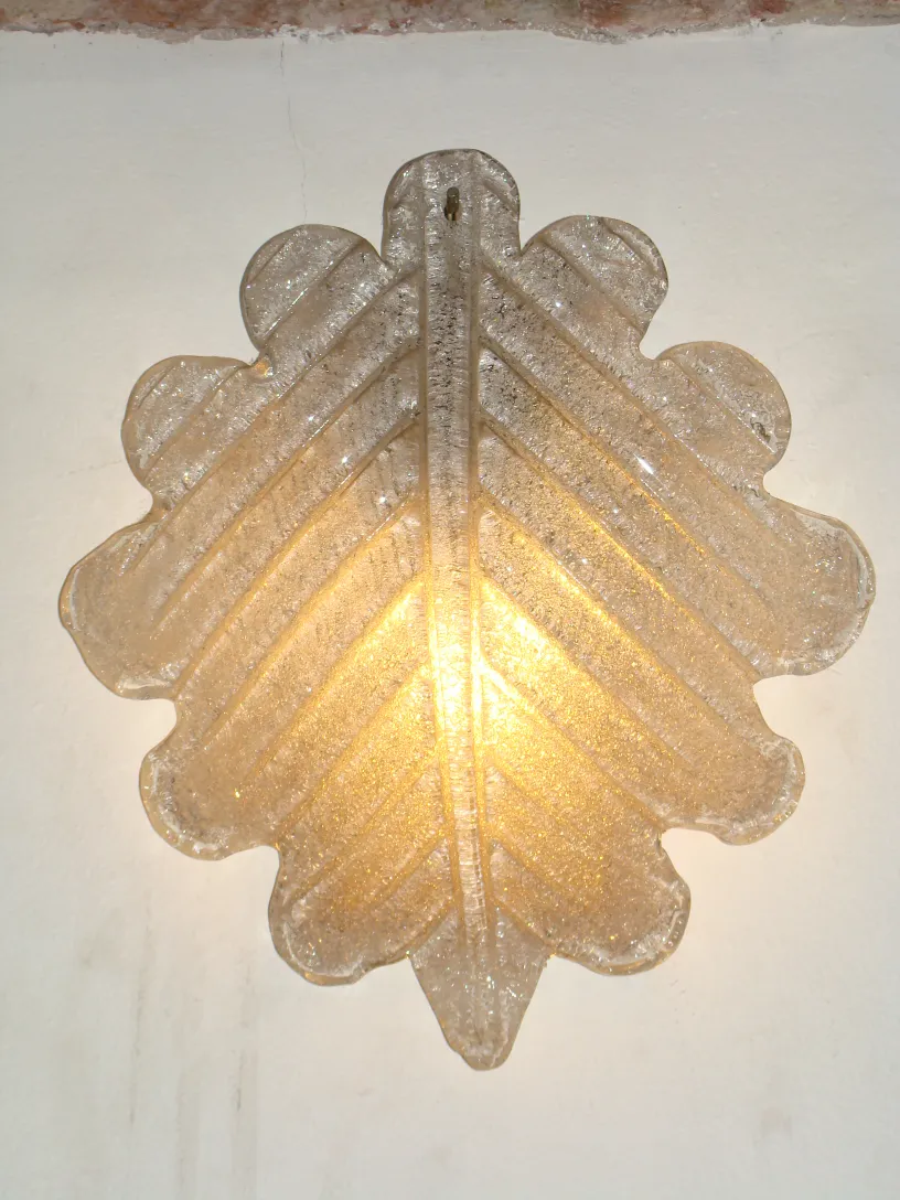 Pair of antique wall sconces in leaf shape with soft light
