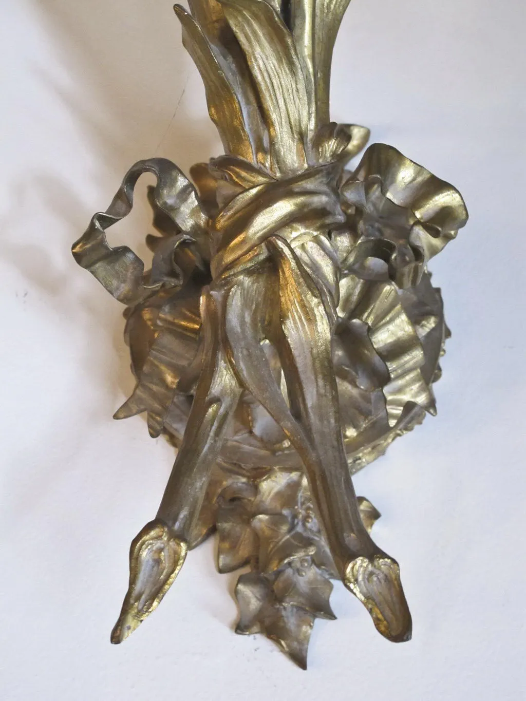 Pair of antique sconces with organic and textured design.