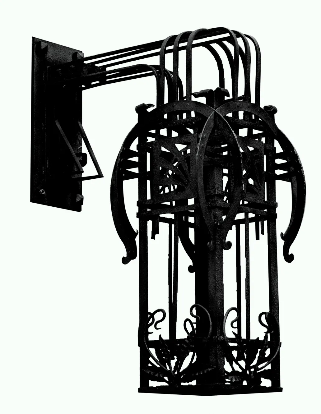 Par de apliques antiguos de hierro forjado con diseño elegante.