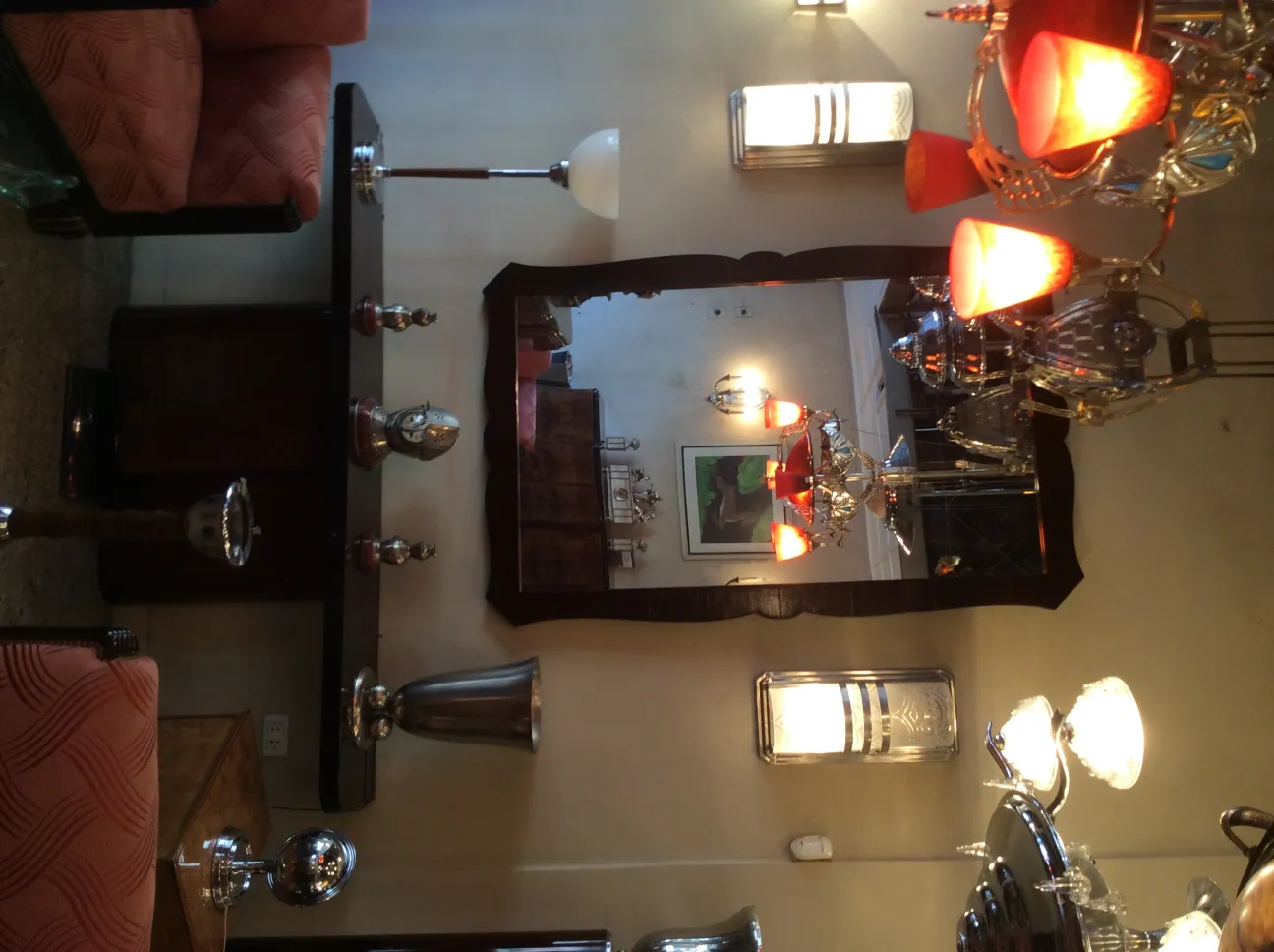 Elegantly adorned with red shades and classic finish, perfect for antique settings.