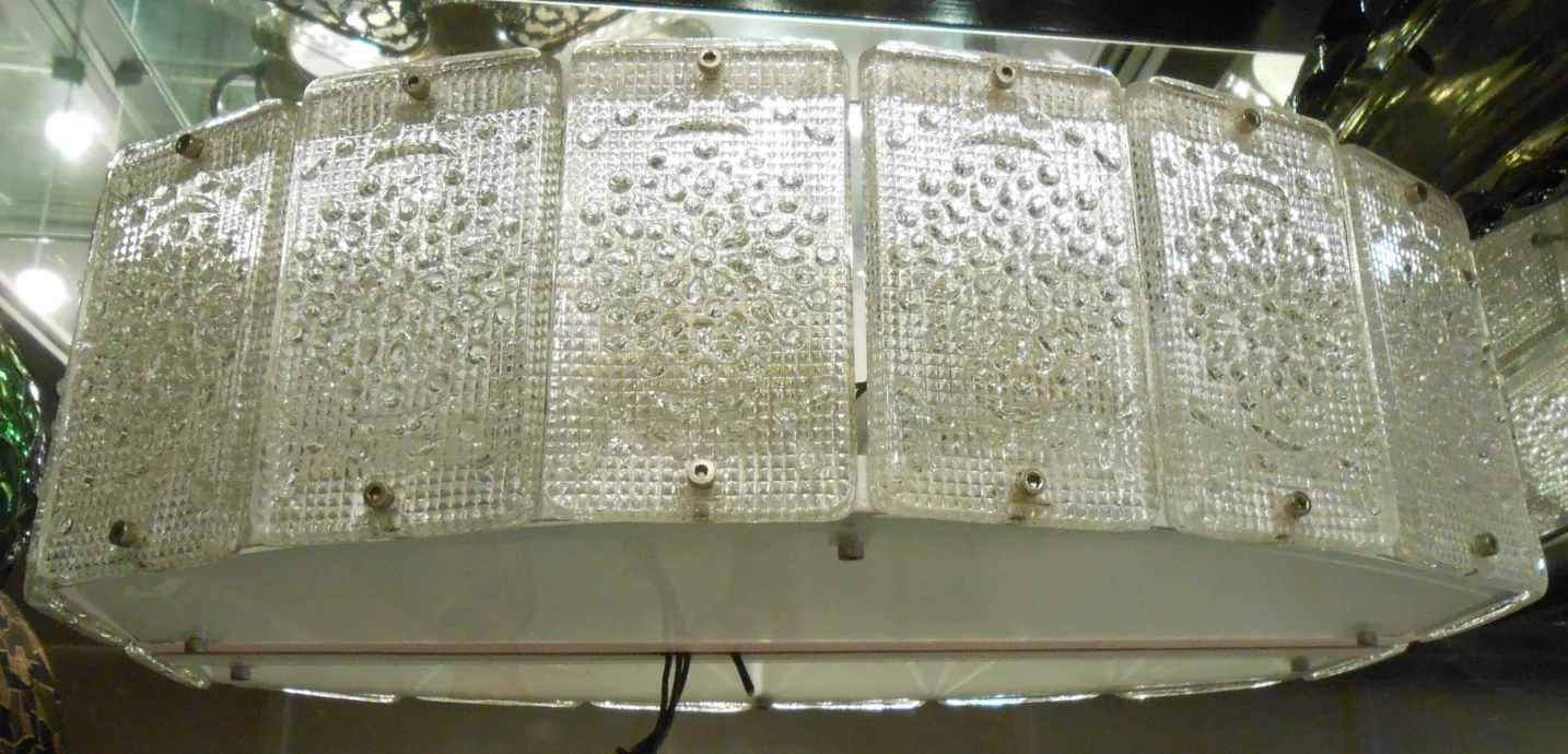 Coppia di applique antiche Orrefors con design unico, illuminando dolcemente l'ambiente.