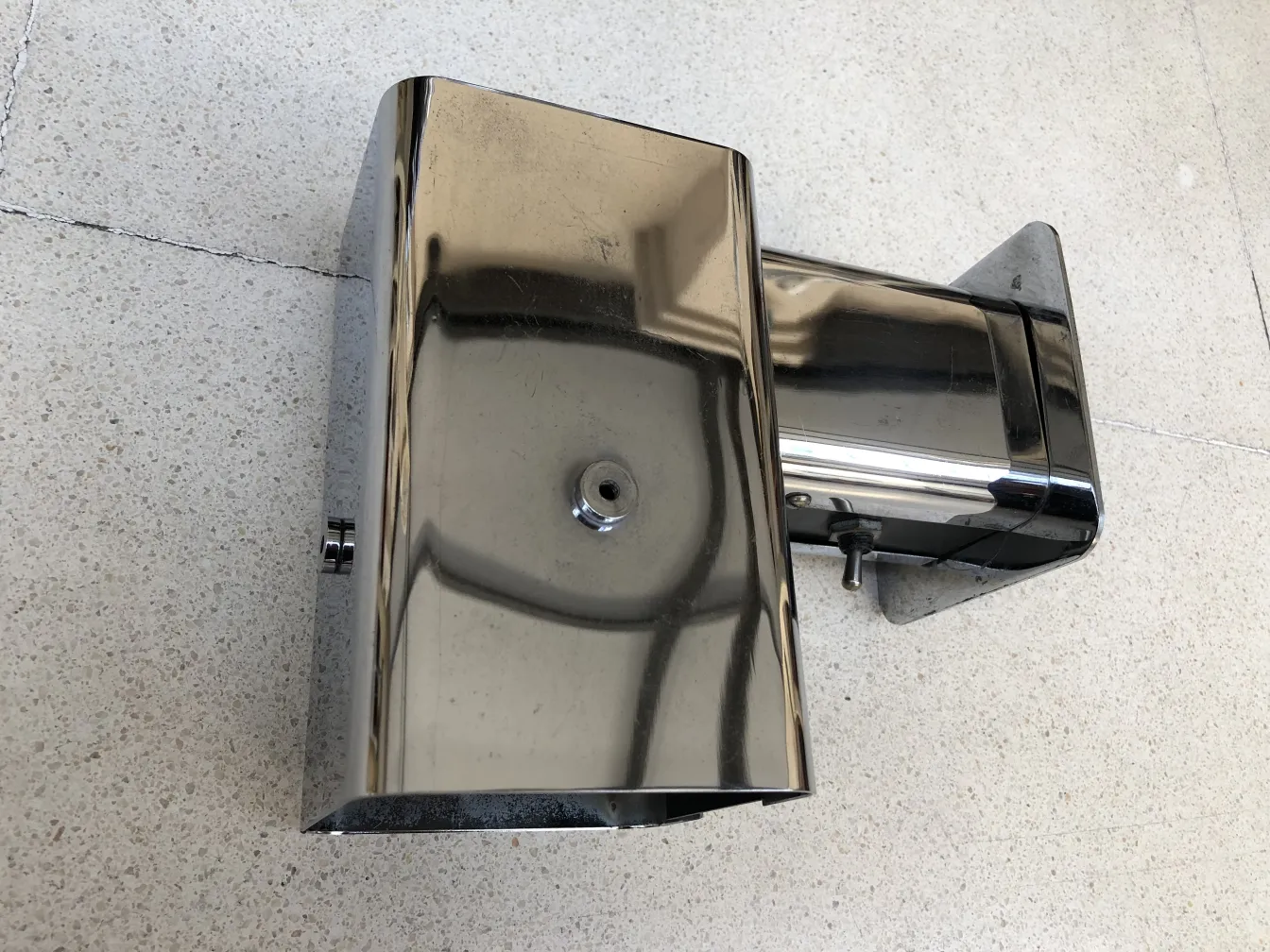 Pair of shiny antique sconces in a neutral setting