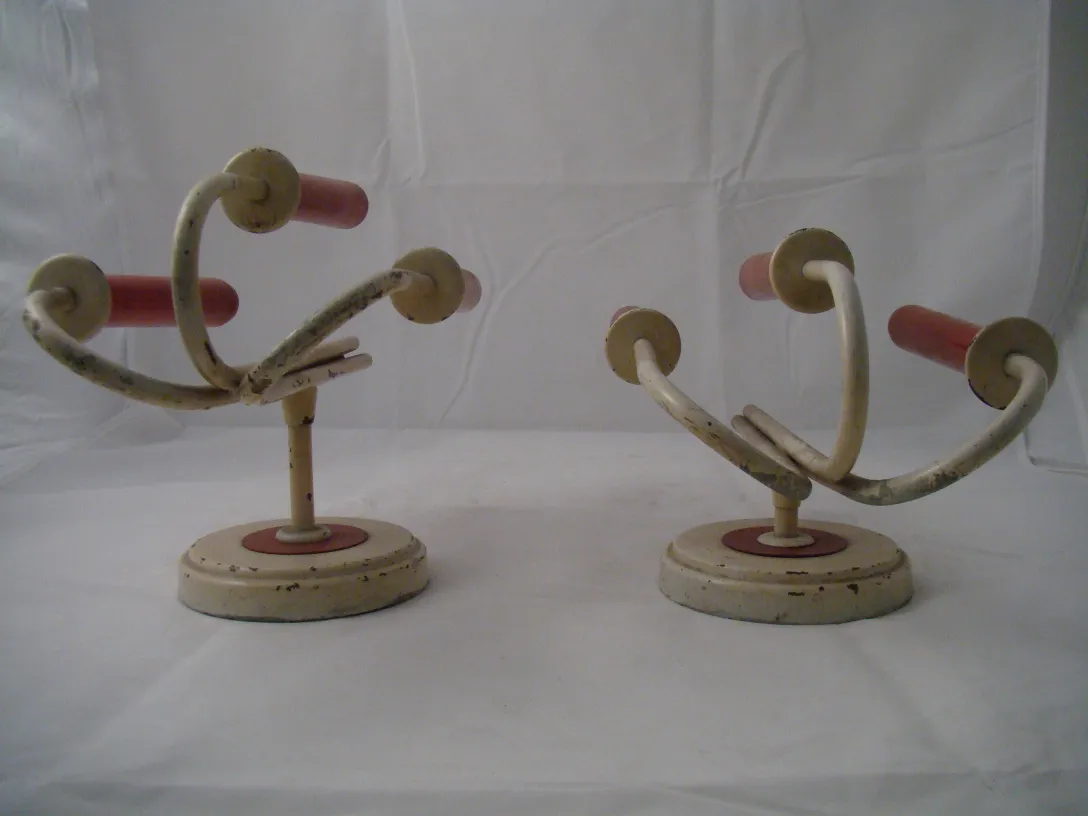 Antique pair of sconces with colorful details Jean royère in a neutral setting.