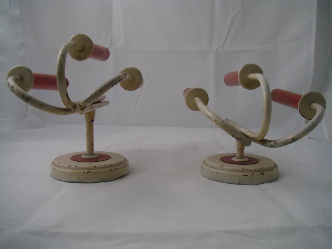 antique sconces with curved design and light colors